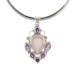 Load image into Gallery viewer, Necklace with a pendant featuring a pink stone and purple gemstones on a white background