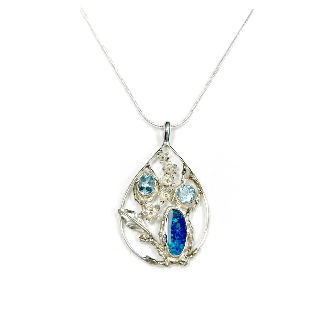 Australian Opal Doublet Pendant with Topaz and Silver Floral Design
