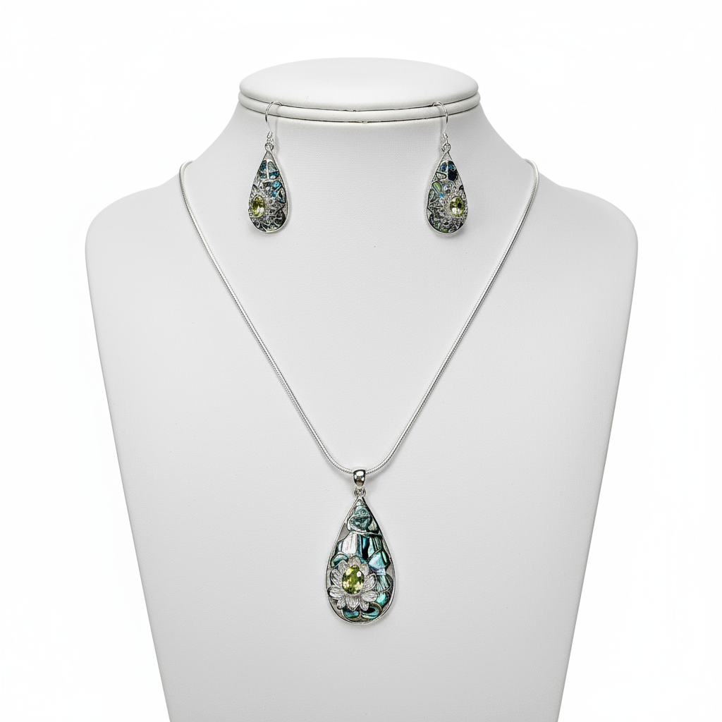 Abalone shell insets with silver and peridot lotus detail earring and pendant set