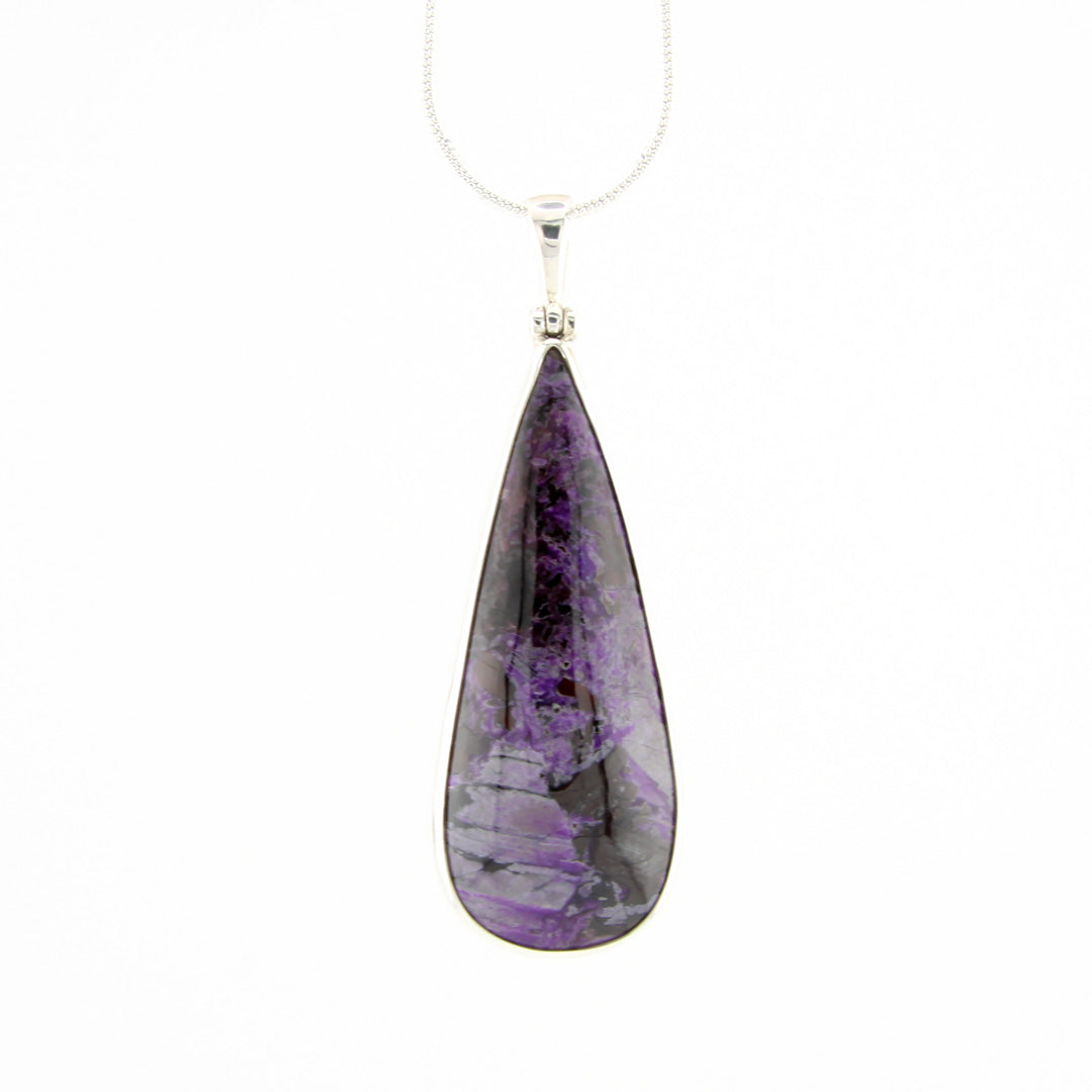 Teardrop shaped purple stone pendant on a white background