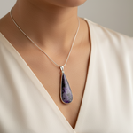 Load image into Gallery viewer, necklace with a purple teardrop pendant against a neutral background
