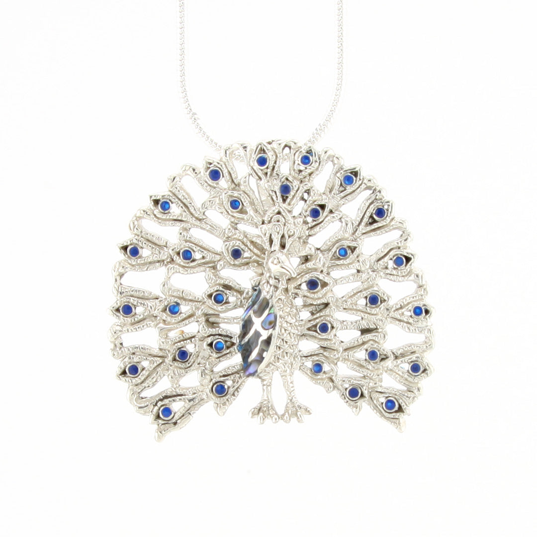 Silver necklace with a peacock feather design and blue stones on a white background