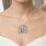 Load image into Gallery viewer, Necklace with a peacock feather pendant on a mannequin
