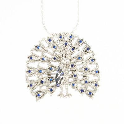 Silver necklace with a peacock feather design and blue stones on a white background